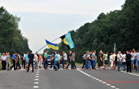 Протестующие против блокировки оформления земли перекрыли трассу Киев – Чоп