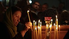 Назад в Средневековье: на Украине церковь собирает «долги» с семей усопших