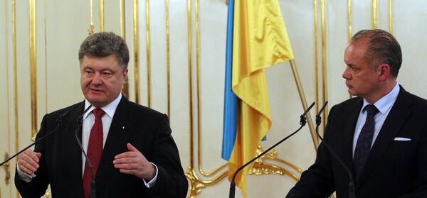 Presidents of Ukraine, Petro Poroshenko, left, and Slovakia, Andrej Kiska, inform the media after talks in Bratislava, Slovakia , Sunday, Nov. 16, 2014.