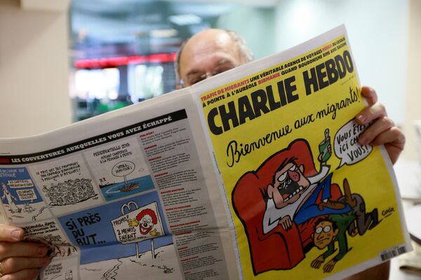 Издание Charlie Hebdo опубликовало карикатуры, героем которых стал утонувший сирийский мальчик Айлан Курди