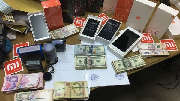 Налоговая служба Украины валюта печати доллары гривна обыск взятка